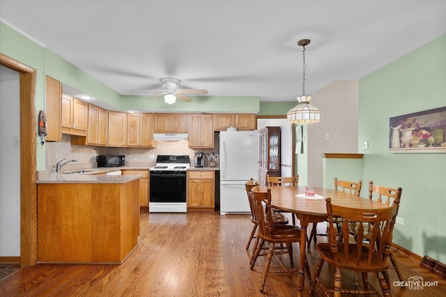 8349 Cristina Ave, Orland Park, IL 60462 - kitchen with white appliances, under cabinet range hood, light wood-style flooring, ceiling fan, and light countertops