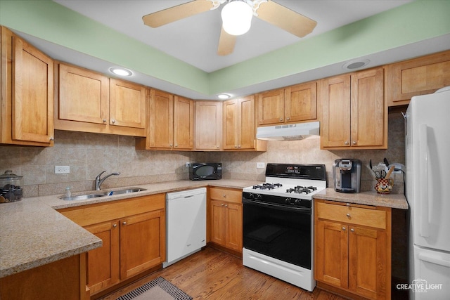 8349 Cristina Ave, Orland Park, IL 60462 - kitchen featuring white appliances, under cabinet range hood, light countertops, and decorative backsplash