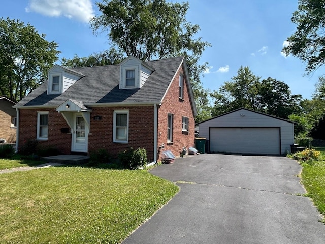 3325 Gilead Ave, Zion, IL 60099 - cape cod home with brick siding, a garage, an outbuilding, a front lawn, and a shingled roof