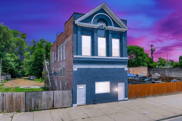 396 E Kensington Ave, Chicago, IL 60628 - view of front of home with brick siding and a patio area
