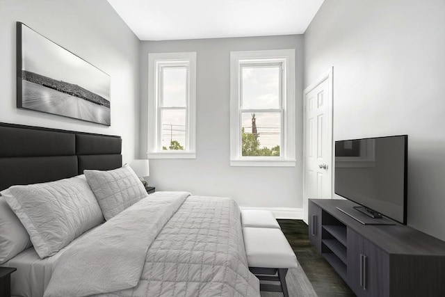 396 E Kensington Ave, Chicago, IL 60628 - bedroom featuring baseboards and dark wood-style flooring