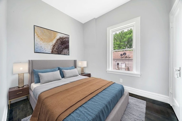 396 E Kensington Ave, Chicago, IL 60628 - bedroom featuring baseboards and dark wood finished floors
