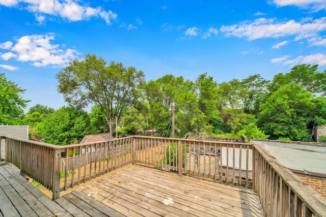 396 E Kensington Ave, Chicago, IL 60628 - wooden deck featuring view of wooded area