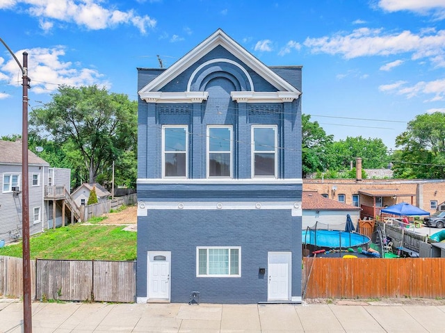 396 E Kensington Ave, Chicago, IL 60628 - view of front of home with brick siding and a fenced backyard