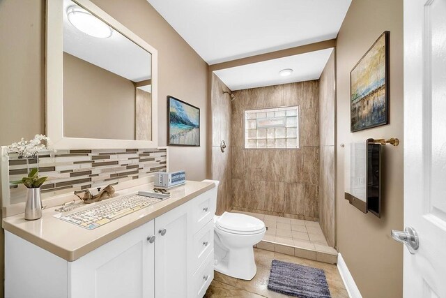 396 E Kensington Ave, Chicago, IL 60628 - full bath featuring vanity, tiled shower, tasteful backsplash, and tile patterned flooring