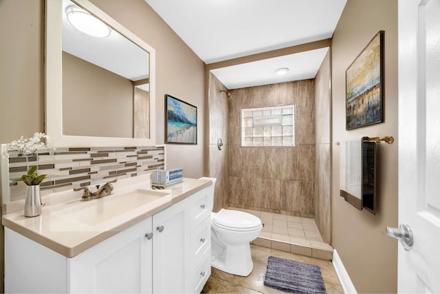 396 E Kensington Ave, Chicago, IL 60628 - bathroom with vanity, tasteful backsplash, a tile shower, and tile patterned flooring