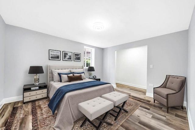 396 E Kensington Ave, Chicago, IL 60628 - bedroom featuring baseboards and wood finished floors