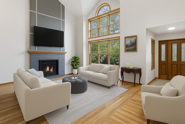 6897 Galena Rd, Bristol, IL 60512 - living area with light wood-style floors, a fireplace, and high vaulted ceiling