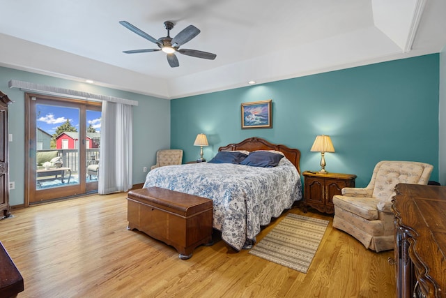 6897 Galena Rd, Bristol, IL 60512 - bedroom featuring a tray ceiling, access to outside, light wood-type flooring, and a ceiling fan