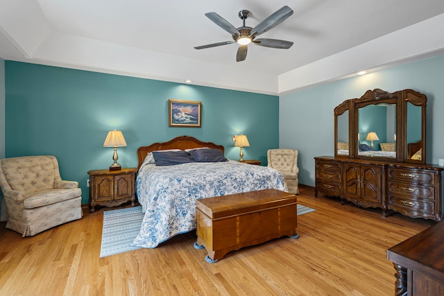 6897 Galena Rd, Bristol, IL 60512 - bedroom featuring a raised ceiling, wood finished floors, and a ceiling fan