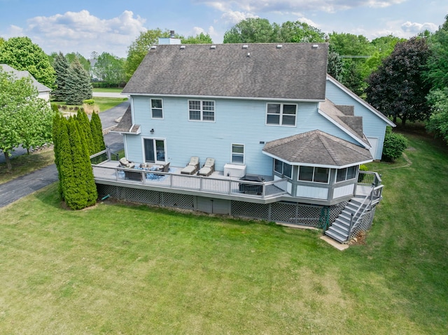 6897 Galena Rd, Bristol, IL 60512 - rear view of property featuring a deck, a sunroom, a shingled roof, a yard, and stairs
