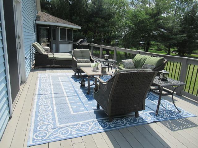 6897 Galena Rd, Bristol, IL 60512 - deck with an outdoor living space
