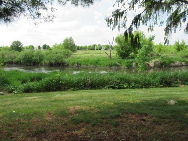 6897 Galena Rd, Bristol, IL 60512 - view of green lawn with a water view