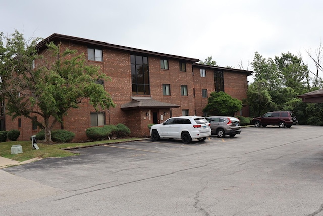 15103 Quail Hollow Dr Unit 604, Orland Park, IL 60462 - view of building exterior featuring uncovered parking