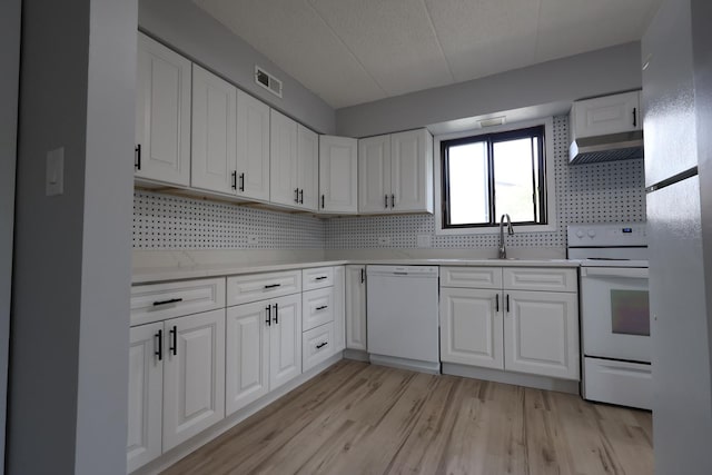 15103 Quail Hollow Dr Unit 604, Orland Park, IL 60462 - kitchen featuring white appliances, backsplash, light countertops, and white cabinetry