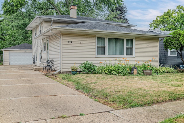 374 Heine Ave, Elgin, IL 60123 - view of front of house with a chimney, an outdoor structure, a front yard, and roof with shingles