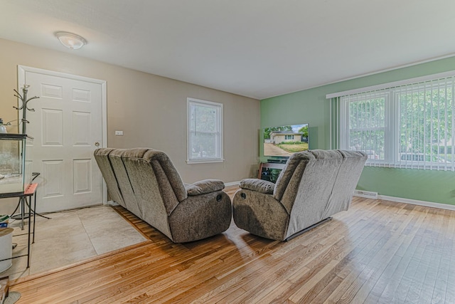374 Heine Ave, Elgin, IL 60123 - living area featuring light wood-style floors and baseboards