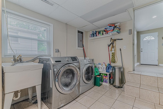 374 Heine Ave, Elgin, IL 60123 - laundry area with washing machine and clothes dryer, tile patterned flooring, and electric panel