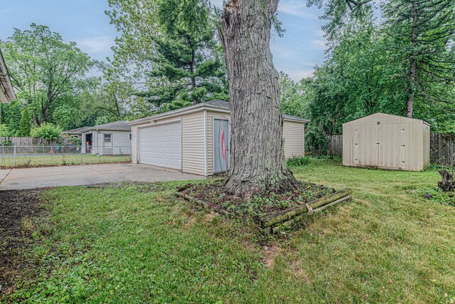 374 Heine Ave, Elgin, IL 60123 - view of yard with a detached garage and a storage unit