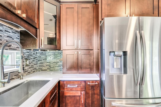 1379 Clavey Ln, Gurnee, IL 60031 - kitchen with stainless steel fridge, backsplash, glass insert cabinets, and light countertops