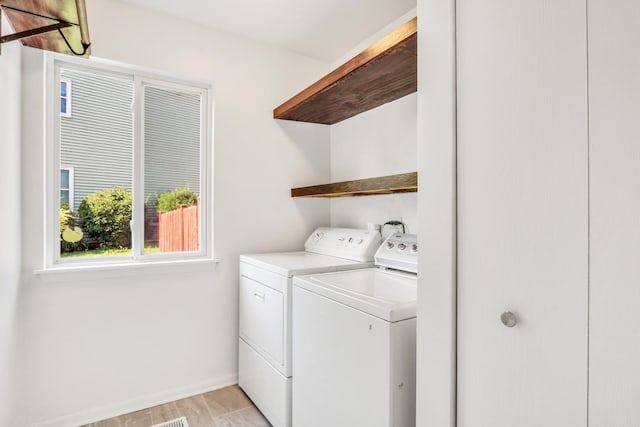 1379 Clavey Ln, Gurnee, IL 60031 - washroom with washer and clothes dryer and baseboards