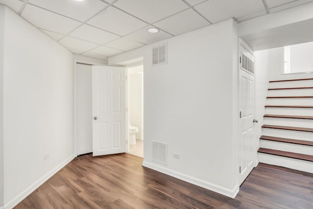 1379 Clavey Ln, Gurnee, IL 60031 - below grade area featuring a drop ceiling, wood finished floors, stairs, and recessed lighting