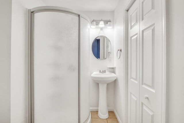 1379 Clavey Ln, Gurnee, IL 60031 - full bathroom with a shower stall, tile patterned floors, and a closet