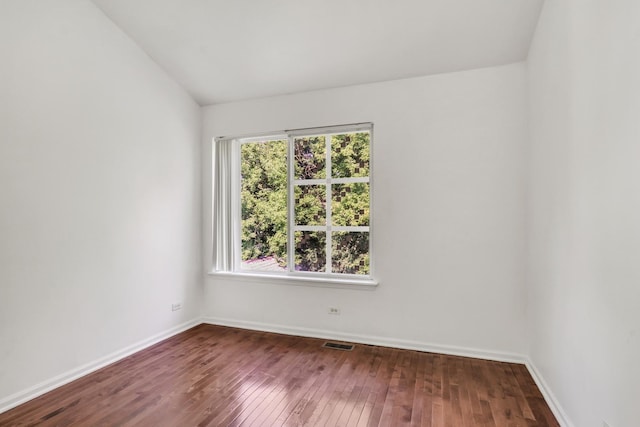1379 Clavey Ln, Gurnee, IL 60031 - spare room featuring dark wood finished floors and vaulted ceiling