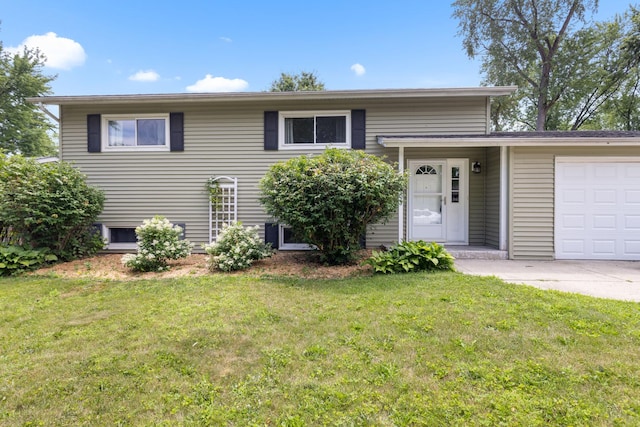 4809 Cayuga Rd, Rockford, IL 61107 - view of front of house featuring an attached garage, a front yard, and concrete driveway