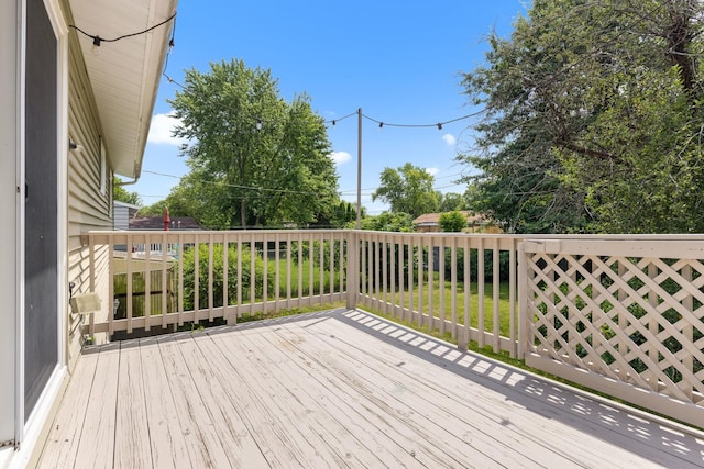 4809 Cayuga Rd, Rockford, IL 61107 - wooden deck with a lawn