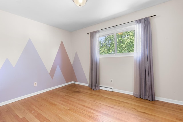 4809 Cayuga Rd, Rockford, IL 61107 - spare room with baseboard heating and light wood-type flooring