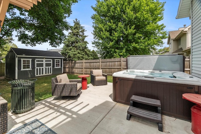 1617 Addleman St, Joliet, IL 60431 - fenced backyard with a hot tub, a patio, and an outbuilding