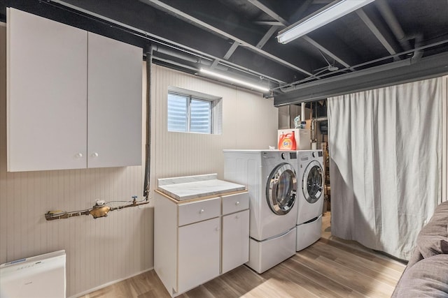1617 Addleman St, Joliet, IL 60431 - washroom with washing machine and clothes dryer, light wood-style floors, and cabinet space