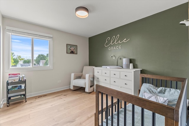 1617 Addleman St, Joliet, IL 60431 - bedroom with light wood-type flooring and baseboards