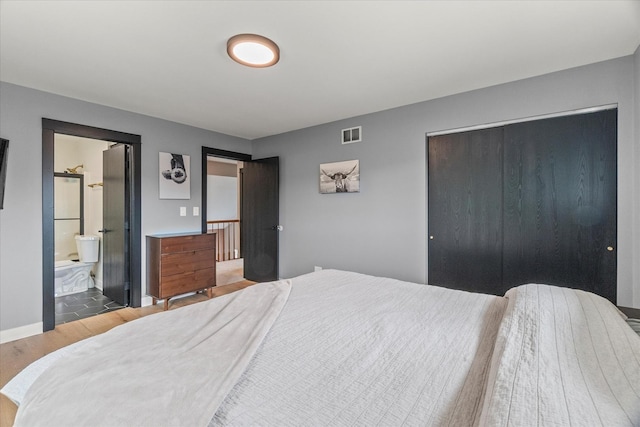 1617 Addleman St, Joliet, IL 60431 - bedroom featuring wood finished floors and a closet