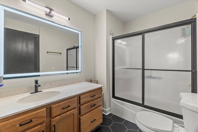 1617 Addleman St, Joliet, IL 60431 - bathroom with vanity, tile patterned flooring, and bath / shower combo with glass door