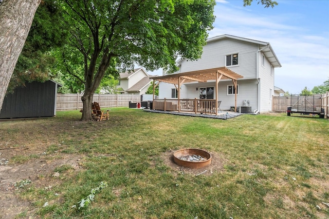 1617 Addleman St, Joliet, IL 60431 - rear view of property featuring a pergola, a fenced backyard, and a fire pit