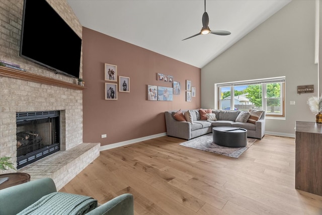 1617 Addleman St, Joliet, IL 60431 - living area featuring high vaulted ceiling, light wood finished floors, a ceiling fan, and a brick fireplace
