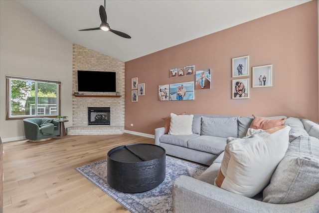 1617 Addleman St, Joliet, IL 60431 - living area with wood finished floors, ceiling fan, a brick fireplace, and high vaulted ceiling