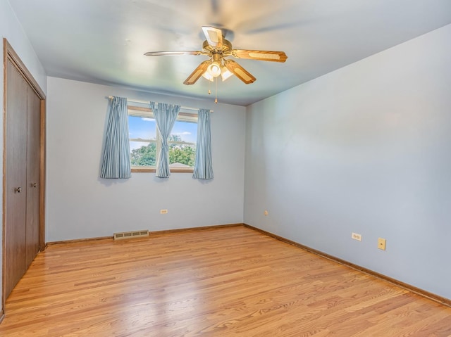 8564 Cherry Stone Pl, Tinley Park, IL 60487 - unfurnished bedroom featuring a closet, light wood finished floors, and ceiling fan