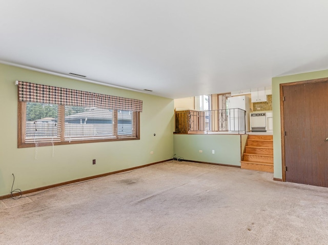 8564 Cherry Stone Pl, Tinley Park, IL 60487 - unfurnished living room featuring light colored carpet and stairs