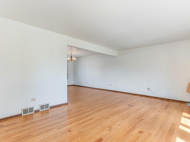8564 Cherry Stone Pl, Tinley Park, IL 60487 - empty room featuring a chandelier and light wood-style floors