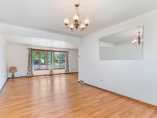 8564 Cherry Stone Pl, Tinley Park, IL 60487 - spare room featuring a chandelier and light wood finished floors