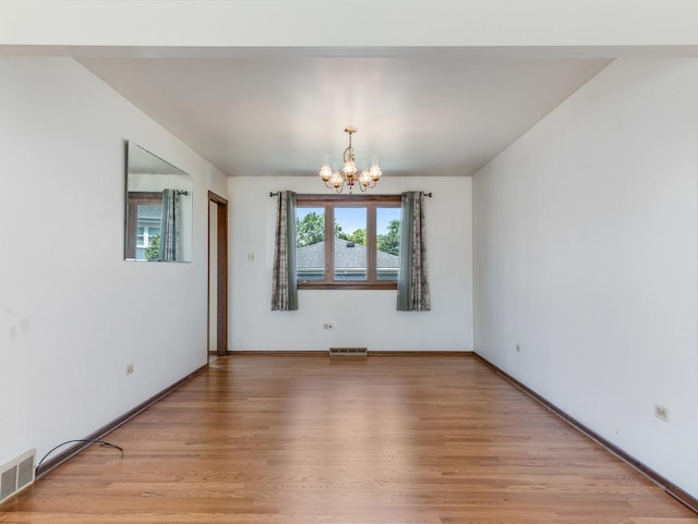 8564 Cherry Stone Pl, Tinley Park, IL 60487 - spare room with a chandelier and light wood-type flooring