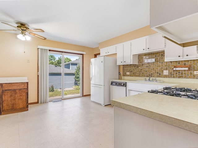8564 Cherry Stone Pl, Tinley Park, IL 60487 - kitchen with white appliances, light countertops, backsplash, ceiling fan, and white cabinetry