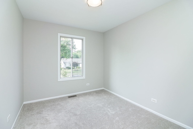 1302 Haverhill Cir, Naperville, IL 60563 - spare room with baseboards and carpet