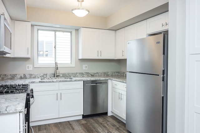 1302 Haverhill Cir, Naperville, IL 60563 - kitchen with appliances with stainless steel finishes, white cabinetry, dark wood finished floors, and light countertops