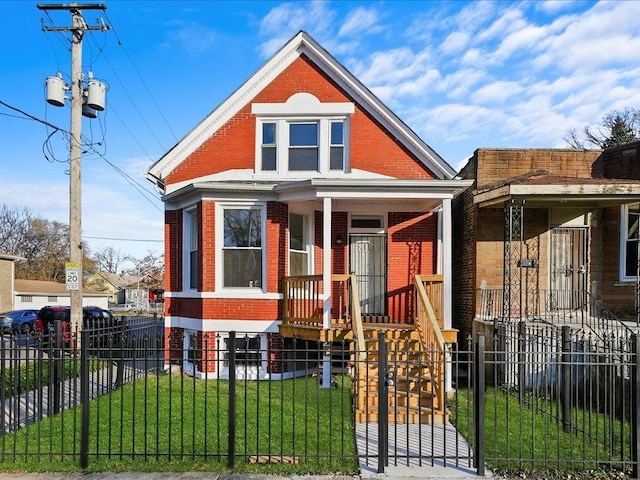 6501 S Hamilton Ave, Chicago, IL 60636 - view of front facade with brick siding, a fenced front yard, and covered porch