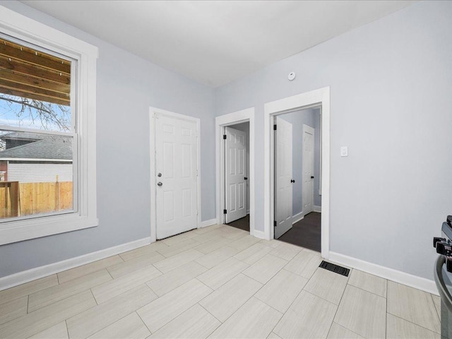 6501 S Hamilton Ave, Chicago, IL 60636 - unfurnished room featuring baseboards and a smoke detector