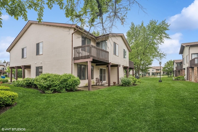 1340 Kingsbury Dr Unit 2, Hanover Park, IL 60133 - rear view of house with a yard, a residential view, and a patio